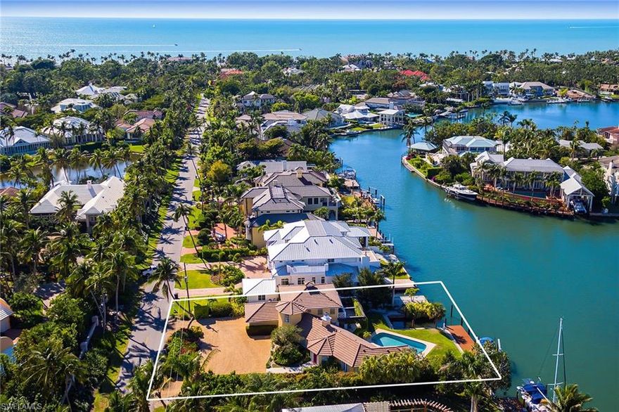 This tranquil waterfront property sits just blocks away from the white sand shores of the Naples coastline, a beach and boating enthusiasts dream come true. An ideal location, this home site boasts long water views down Ibis cove and deep water intersecting canals which provide direct Gulf access through Gordon Pass. The updated dock with boat lift and a separate grandfathered boat slip allow owners to enjoy additional sailing and yachting possibilities. This four bedroom, three and one half bath home can be lived in while designing your ideal waterfront retreat at this spectacular location. The existing property is being offered, “as-is”.