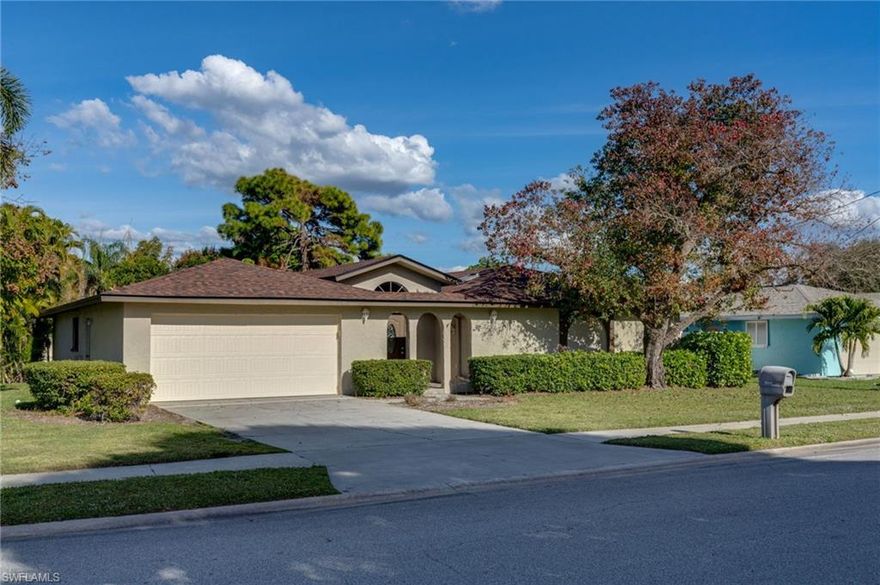 What is unique about this home? Not 1 but 2 Primary Suites come with this pool home on a corner lot located in the established Waterway Estates boating community. Offering 4 Bedroom 3 Bath + Den with solid wood floors throughout with carpet in the bedrooms this home is ready for an in house care giver or ready to host guest/visitors. The large open kitchen has white cabinets, granite countertops, recessed lighting & offers plenty of counter space in case the kids want to help you bake the cookies? Both Primary Bedrooms are spacious with their own private bathrooms. Relax out back in your screened in porch with double pocket sliding glass doors and a sparkling blue pool for those warm sunny days. Roof was replaced 2023 A/C was replaced 2024. Home has irrigation and mature landscaping. New hurricane rated garage door, New pool pump, Newer water heater. Come and explore the possibilities this home offers today!