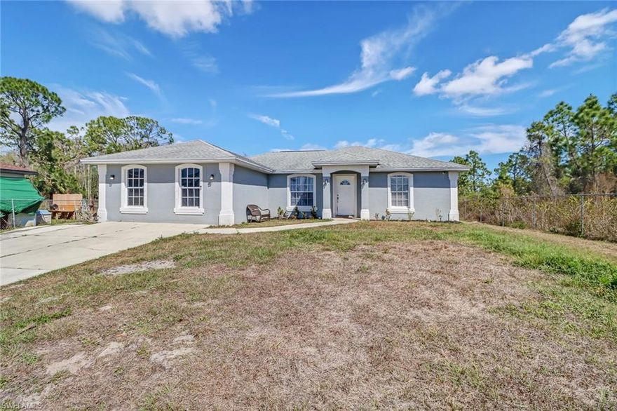 Discover this charming home in the desirable Golden Gate Estates!  The Property is fenced, has a concrete driveway and a very large concrete slab attached to the home which is great for outdoor living. The garage was converted into a large family room (permitted) that is perfect for children to play or to entertain your guests. Marble tile throughout the house. This is a perfect starter home. Don't miss your opportunity because it won't last long.