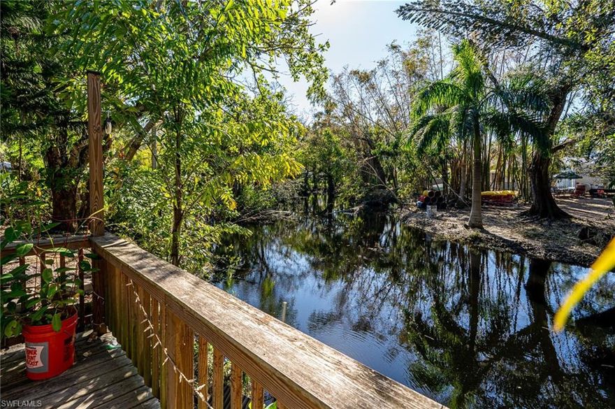 H7256- One of several homes that stayed high and dry on Kentucky St. during Ian. No insurance claims were filed for Irma or Ian. This tranquil oasis is situated on the beautiful Oak Creek and a short distance from the historical down town Bonita Springs. Explore Riverside Park, Restaurants, Bonita Coffee/Wine, music, art and more. Enjoy Kayaking or a small fishing boat on the creek which leads out to the Imperial River. Watch wildlife such as turtles, alligators, birds and an occasional manatee or otter. The Seller was preparing this Gem for the market just prior to the storm. It has been freshly painted inside and out and given some freshening throughout the home. The roof has been checked and in good condition. There are two sheds with electric on the property. This is a 3 bedroom 2 bath home with a one car carport and tiled flooring throughout. The rear of the home is a tropical sanctuary. Watching the video is a must to get the understanding of the beauty of this property. This home would make a very nice Airbnb. Be part of the Florida rebirth. Florida Strong!