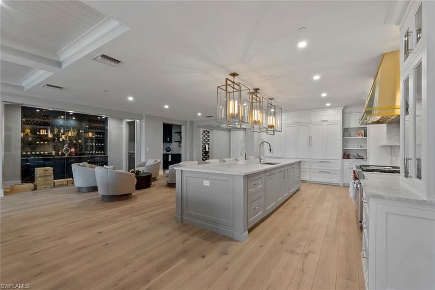 Worldbid Auction –  MAY 12, 2026 NOON - Qualifying round sealed bids due no later than May 12, 2026 noon. Bidders within the top 50% by price will be notified on May 12 to submit the Final sealed bid on May 13, 2026, 3pm 2026. Bidders final bid is due no later than May 13, 2026 Noon 2026. The Successful Bidder will be notified on May 13, 2026  they are the winning bidder of the Property. A Pre Auction offer must be submitted no later than May 4, 2026. The accepted offer will state the buyer will remove all contingencies no later than May 8, 2026 or close escrow by that date. If the Buyer removes contingencies or closes escrow no later than May 8, 2026, the auction will be cancelled. Buyer’s may obtain financing, though financing is not a contingency to close. Proof of funds to close and/or a lender’s approval letter are required with your bid. You may conduct your inspections anytime. Buyer’s may obtain financing, though financing is not a contingency to close. Proof of funds to close and/or a lender’s approval letter are required with your bid. You may conduct your inspections anytime. 

This rare double-unit residence at La Perle defines modern coastal luxury. Combining Units 302 & 303, this extraordinary home offers almost 6,000 sq ft of beautifully designed living space overlooking the tranquil marina. The open-concept floor plan features floor-to-ceiling windows, wide-plank flooring, and a gourmet kitchen appointed with Wolf and Sub-Zero appliances, custom cabinetry, and an expansive entertaining island. The primary suite is a serene retreat with a spa-inspired bath and terrace access, while three additional ensuite bedrooms provide comfort and privacy. A sophisticated office/den captures sweeping Gulf views, creating an inspiring setting to work or unwind. Enjoy an unparalleled outdoor lifestyle with a resort-style infinity pool, oversized hot tub, putting green, and outdoor bar—perfect for entertaining or relaxing under the Naples sun. Additional features include four parking spaces, a private boat slip, and direct beach access just steps away. Perfectly situated along prestigious Gulf Shore Boulevard North, La Perle offers a rare blend of elegance, comfort, and waterfront living—just minutes from Naples’ world-class dining, shopping, and entertainment.