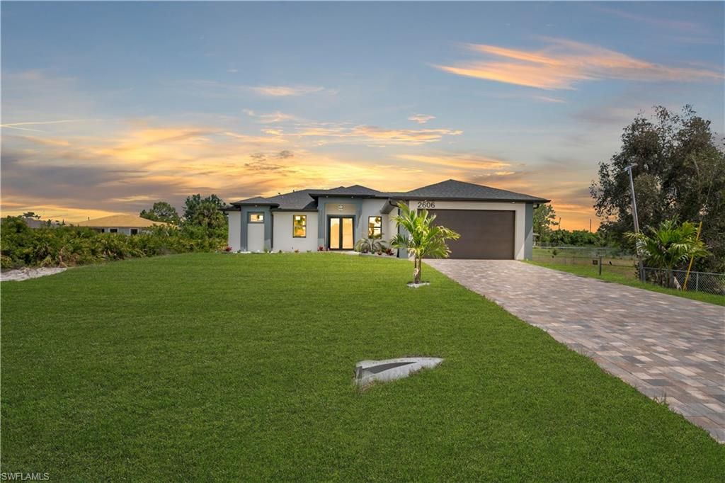 Photo of 2606 40th ST SW, LEHIGH ACRES, FL 33976 (MLS # 226017245)