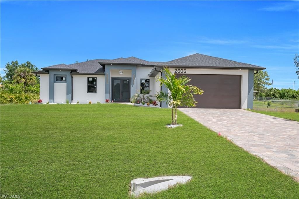 Photo of 2606 40th ST SW, LEHIGH ACRES, FL 33976 (MLS # 226017245)