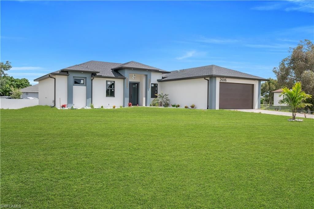 Photo of 2606 40th ST SW, LEHIGH ACRES, FL 33976 (MLS # 226017245)