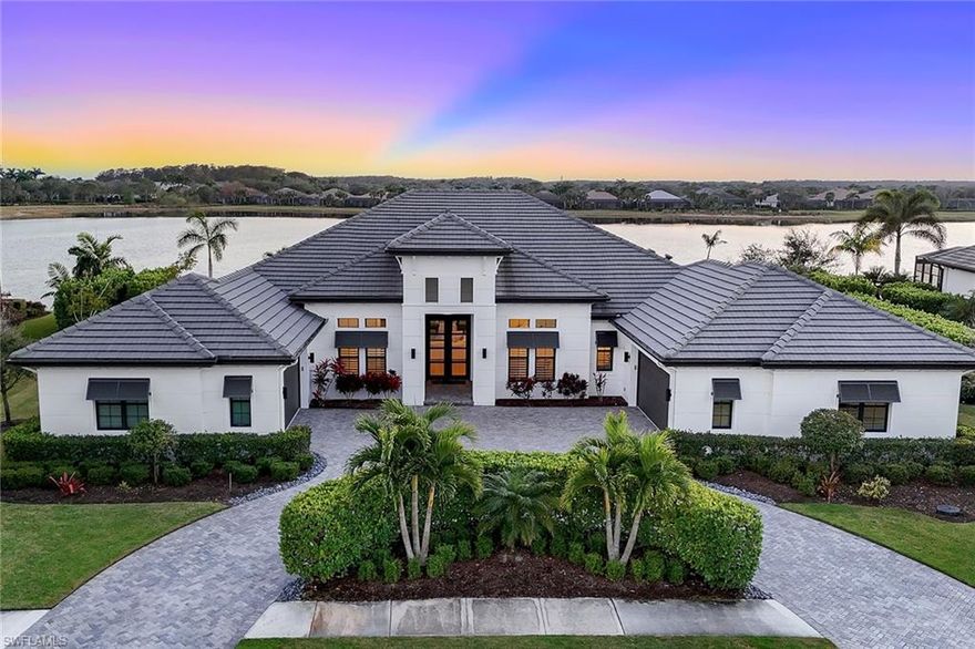 This Arthur Rutenberg-built masterpiece was designed to impress, showcasing unparalleled craftsmanship, designer touches and an elevated approach to indoor-outdoor living. With a coveted full golf membership included — no waiting list required — you’ll gain immediate access to the exclusive TwinEagles lifestyle. Every corner inside reflects meticulous attention to detail. The stunning fifth wall designs, from lighted coffered and tray ceilings to the artistry of tongue-and-groove accents on the lanai, elevate the space to an artful expression of modern elegance. Designer touches are evident throughout, from the custom shiplap feature walls to the exquisite crown molding and handpicked chandeliers and fixtures that enhance the refined atmosphere. The great room layout blends functionality and style, with wood flooring, recessed lighting, and surround sound systems creating a harmonious living experience for both intimate moments and large-scale entertaining. The gourmet kitchen boasts a quartz island, Dacor appliances, under-cabinet lighting and a walk-in pantry. Outdoor living reaches new heights with a sprawling south-facing lanai seamlessly extending beyond a wall of pocketing sliders. Unobstructed lake views are framed by three picture screens, while a gas stone fireplace, outdoor TVs, and an electric-heated saltwater pool and spa with captivating water features and fire bowls create an atmosphere of resort-style luxury. The fully equipped outdoor kitchen ensures effortless entertaining, with every amenity for your gatherings. The artistry continues into the primary suite, where thoughtful details are evident at every turn. Recessed lighting and crown molding elevate the space, while the shiplap feature wall adds visual intrigue. Blackout curtains provide ultimate privacy for restful nights. The suite includes two custom walk-in closets, and the spa-inspired bath boasts a soaking tub, a massive tile shower with multiple heads, and elegant quartz vanities, offering a luxurious retreat. The circle drive, four-car garage with split AC and epoxy flooring, hurricane-impact windows and doors, and a full-house generator add practicality to the property’s laid-back opulence. Located in TwinEagles, this residence offers the ultimate in luxury living, complete with a full golf membership that gives you immediate access to world-class amenities. Don’t miss your opportunity to experience this extraordinary lakefront estate, where every detail has been meticulously crafted to provide a lifestyle of comfort, elegance and recreation.