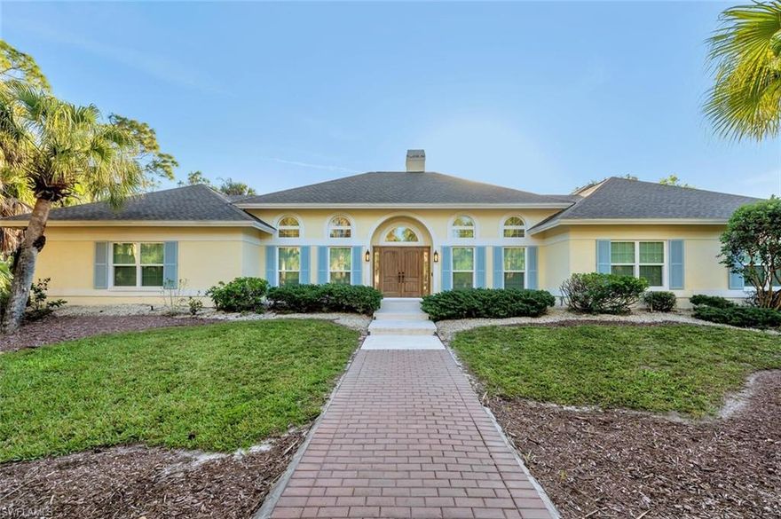 Set on nearly three acres, this exceptional 5 bedroom plus den, 4 bath estate captures the essence of luxurious Naples living. Offered unfurnished as an annual rental and available immediately, this stunning residence is ready to welcome you home. From the moment you enter, you’ll be impressed by the thoughtful design and refined finishes, including wide-plank wood flooring, soaring volume ceilings, and contemporary lighting throughout. The light-filled living room features a charming brick fireplace and double doors that open seamlessly to the pool area, creating an effortless indoor-outdoor lifestyle. The chef-inspired kitchen is truly the heart of the home, showcasing stainless steel appliances, custom cabinetry, a wine refrigerator, double wall ovens, Taj Mahal quartzite countertops, a walk-in pantry, and a spacious island with an induction cooktop—perfect for entertaining. The adjacent dining area is highlighted by a large picture window overlooking the serene outdoor oasis, while a cozy family room with built-in cabinetry and ceiling fans provides an inviting space to gather. A dedicated home office offers the ideal setup for remote work or quiet study. The elegant primary suite features stylish shiplap accents, a walk-in closet, and direct access to the pool. The spa-like primary bath is designed for relaxation, complete with marble floors, a double vanity, a soaking tub with chandelier, and a walk-in shower. Guests will feel right at home in four generously sized bedrooms, including one with a private ensuite bath. The well-appointed laundry room includes abundant storage, a utility sink, and an oversized washer and dryer for added convenience. Outside, the lushly landscaped front yard and circular driveway lead to a three-car garage. Additional features include impact windows and a whole-house reverse osmosis system. Just outside your private retreat awaits with a screened-in pool and expansive lanai, perfect for relaxing or entertaining in complete privacy. Ideally located just minutes from Naples’ world-renowned beaches, as well as premier shopping and dining, this home offers the perfect blend of tranquility and convenience. Live exceptionally in Golden Gate Estates!