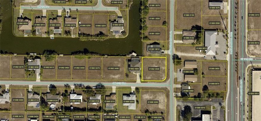 Built your dream home on this large corner lot with canal view! Located in the heart of Cape Coral in a beautiful neighborhood, near shopping, dining and Lake Kennedy Sunsplash Waterpark. Buyers to assume small balance of sewer assessment.