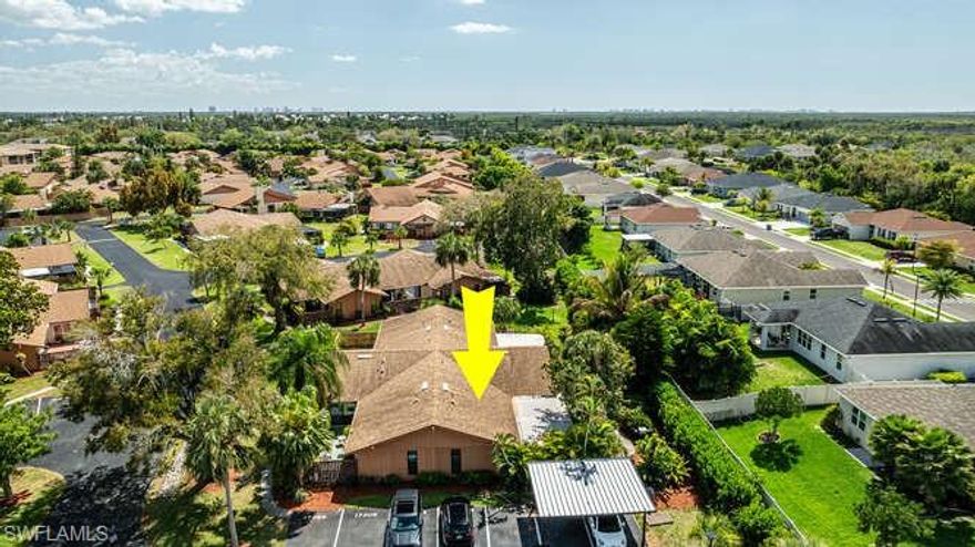 The standout feature of this home is the massive covered and screened lanai, which functions as a true second living room. Whether you’re hosting game days, enjoying an alfresco dinner, or simply relaxing in the shade, this versatile outdoor space seamlessly extends your footprint. Inside, the high vaulted ceilings and open-concept layout create an airy, voluminous feel, while the modern kitchen shines with crisp white cabinetry, stainless steel appliances, and premium stone-patterned countertops. Designed for maximum privacy and flexibility, the floor plan features two spacious master suites, each with its own attached bathroom. This "double primary" setup is ideal for roommates, multi-generational living, or hosting overnight guests. Throughout the home, durable and stylish tile flooring ensures easy maintenance and a clean, coastal aesthetic. ituated with a private backyard exposure, you can enjoy peaceful afternoons without direct rear neighbors. Recent community-wide initiatives have focused heavily on improving drainage infrastructure, providing residents with enhanced peace of mind during Florida’s summer rains.  Living in Royal Woods means access to a relaxed lifestyle with fantastic amenities, including a community pool, tennis courts, and pickleball. Your new home comes with a dedicated covered parking space and is just minutes from the best of SWFL: Quick access to Gulf Coast Town Center and Bell Tower Shops. Less than 15 minutes to RSW, the perfect distance for those who travel, have visitors, or snowbird in SWFL. This location is a short drive to the white sands of Fort Myers Beach and Sanibel Island.