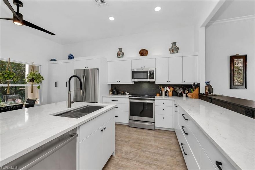 Designed for both comfort and accessibility, this residence offers a beautifully open layout with luxury vinyl and wood plank flooring throughout, an ADA-accessible design, and tastefully renovated kitchen and baths showcasing sleek, modern finishes. The spacious two-car garage provides abundant storage for golf gear, beach essentials, and everyday organization. Step outside to your private pool and fenced yard—an ideal setting for relaxation, entertaining, or giving furry family members space to play. Beyond your doorstep lies a vibrant, resort-style community with endless amenities: eight Har-Tru tennis courts, six lighted pickleball courts, and three lighted bocce courts for continuous play. Stay active at the state-of-the-art fitness center with onsite trainers, classes, and spa services, or unwind at Courtside at Pelican Marsh for casual dining and social gatherings. Golf enthusiasts will appreciate the private 18-hole Audubon-Certified championship course, while nature lovers will enjoy 2,075 acres of lush landscape and the 133-acre Cocohatchee Strand Nature Preserve. With a 25,000-square-foot clubhouse and convenient beach shuttle to Delnor-Wiggins or Barefoot Beach, this home offers an unmatched blend of elegance, comfort, and the ultimate Naples lifestyle—just minutes from world-class shopping, dining, and the airport.