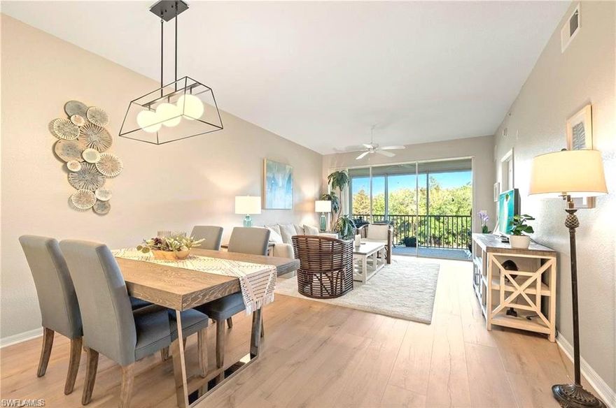 Stunning and most affordable Sterling Greens condo with Full Golf membership included. Move right in! Notice volume ceilings as you enter. Rare model with EXTRA ROOM off the kitchen currently used as an in home office. Imagine your day starting on your private screened lanai sipping cofgee and watching golfers and breathtaking panoramic VIEWS of 17th fairway greens -- no buildings across only lush preserves. WIDE-PLANK wood look luxury vinyl and TILE flows all throughout. ELECTRIC SHUTTERS makes easy closing. FULL golf membership included too. Interior designer's NEW FURNISHINGS remain if desired so bring your toothbrush and move right in! NEW DESIGNER LIGHTING. Kitchen has 42" CABINETS, updated NEW STAINLESS CONVECTION OVEN and microwave. A stylish arch and breakfast bar opens to dining-living area —perfect for entertaining. Spacious primary suite has a door to the lanai and 2 walk-in closets. The split bedroom plan allows privacy for you and guests. Comes with your own locked STORAGE UNIT for bikes, beach chairs, Golf clubs, etc.. Trash shoot at elevator so easy disposal. Covered parking spot included, and option to buy vehicle. Offers amenities of a Community pool, BBQ area, picnic tables, bike racks, neighbor socials. Close to The Divot, with full fitness, bocci, breakfast, lunch, bar. Up to the Clubhouse enjoy dining, a bar, ping pong, billiards, library, card rooms, fire pit, events. For active enthusiasts, enjoy golf leagues, lit Har-Tru Tennis, pro shop, lessons, fitness classes. Every convenience out front or back gates — and just 4 mi to Olde Naples, white sand beaches, dining, shops, art, theater. Perfect for Full or Part time, or investment (rented Feb and March for automatic income). See it, you'll love it.