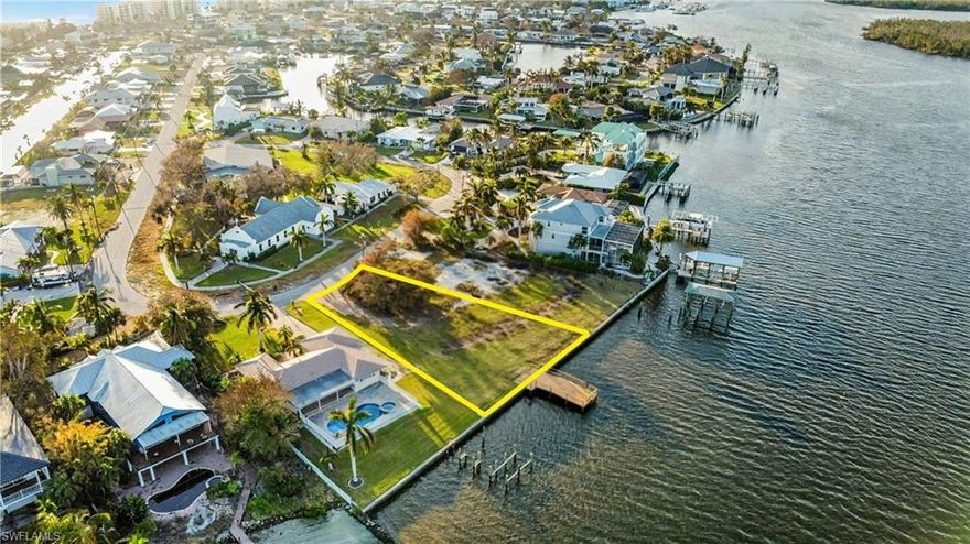 PREMIER BAYFRONT HOMESITE — BUILD YOUR DREAM HOME ON ESTERO BAY
Paradise awaits on this rare, oversized Bayfront homesite offering direct Gulf access along the protected and prestigious Estero Bay Aquatic Preserve. Spanning 11,230 square feet with an impressive 95 feet of Bay frontage and 155 feet of depth, this exceptional property provides the ideal canvas to construct a new elevated two- or three-story Bayfront residence designed to capture sweeping water views and unforgettable sunsets.
Enjoy front-row seating to nature’s daily show—dolphins and manatees gliding through the bay—right from your future private dock. Positioned on a quiet cul-de-sac and among the highest elevations on the island, this property is located within the highly desirable Holiday Heights neighborhood, offering both privacy and prestige.
The existing structure is considered a teardown, and the property is being sold at lot value, allowing full creative freedom to design a custom home perfectly tailored to your lifestyle. Multiple builder introductions are available to assist in bringing your vision to life.
Just a short stroll to deeded beach access, a nearby marina, and a grocery store, this one-of-a-kind bayfront parcel delivers the ultimate blend of boating, beach, and luxury island living. This is a rare opportunity to create a true coastal residence and be part of the ongoing Fort Myers Beach Renaissance.