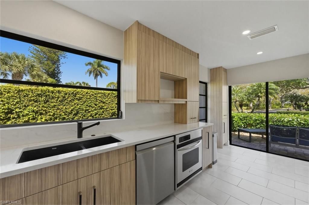 Photo of 909 Reef Point CIR, NAPLES, FL 34108 (MLS # 226011158)