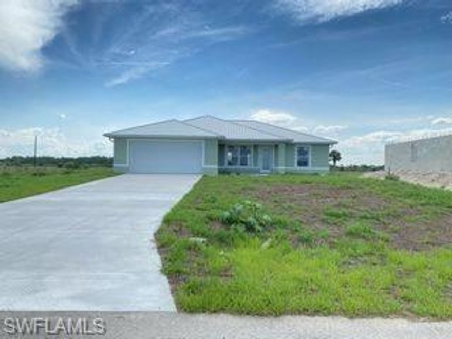 C/O in weeks.  IMPACT RESISTANT WINDOWS & METAL ROOF!! Quality Quality Quality by Blue Line Homes with granite tops on SOLID WOOD soft close cabinets, tile backsplash, vaulted ceiling,  icynene spray insulation, KOHLER toilets, tankless water heater. Even has full gutters! 1 year bldr warranty included.
