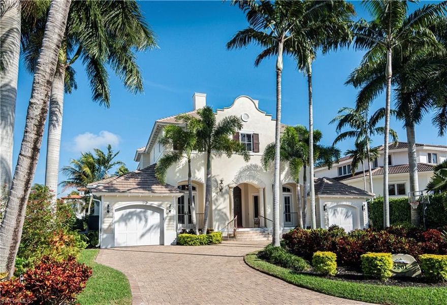 Indulge in luxurious resort style living, on the serene side of Royal Harbor.  Take pleasure in the peaceful, "wide water" Bay views of Haldeman Creek.  Multiple balconies allow you to enjoy observing the myriad of wildlife that jump, dive, swim, and fly through this tranquil, natural preserve enveloped area.  This elegant home has a timeless beauty, reminiscent of a tropical, Mission Revival style architecture. It will feel like an "endless weekend" as you delight in the inviting outdoor entertainment area with alfresco kitchen, rock waterfall spa, and glistening disappearing edge pool.  Further amenities offered are a private elevator, lavish master suite that includes a wet bar, dual laundry rooms, formal and informal spaces for entertaining, billiard/flex room (that can be converted to fourth bedroom), and an inviting, open kitchen, that will surely be the heart of many festive gatherings.  The direct Gulf access with boat dock and lift will undoubtedly appeal to leisure boaters, while the close proximity to downtown Olde Naples will entice those attracted to all the best things, that Naples has to offer. Luxury, location, and unsurpassed living.