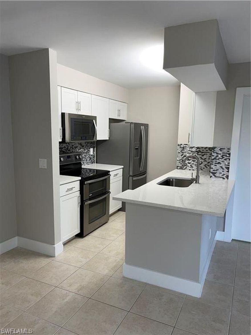 Beautifully remodeled 1 Bedroom/1 Bath unit in Granada Lakes. First-floor, open floor plan, with access to screened-in Lanai that includes a closet with your own washer/dryer. The Kitchen & Bathroom have been remodeled to include new cabinets, white quartz countertops & stainless steel appliances. Bedroom with walk in closet. Tile throughout. This active community just spent $2.5 million on the common areas to enhance their residents lifestyle. The updates include new guard gates, clubhouse, 2 pools and spa, new exercise room, tennis court, and reserved parking. Close proximity to I-75, Naples Famous Beaches, and the Dining/Shops of Downtown 5th Ave. Ideal for investors. Very good return on investment. Already tenant in place. Start collecting rent right away.