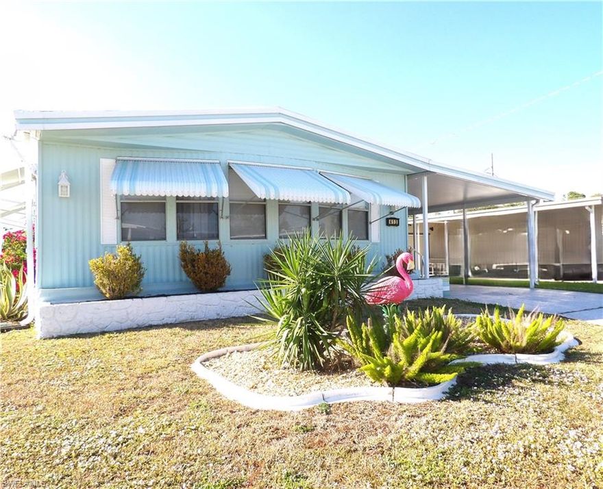 WELCOME HOME to this STUNNING RENOVATED residence, offering a seamless blend of style and sophistication. This 2-bedroom /2-bathroom home has been completely remodeled with fantastic upgrades. Featuring a spectacular kitchen with newer appliances, cabinets and quartz countertops! Enjoy the large breakfast bar located off of the kitchen for entertaining.  Extra built in cabinets for storage with glass doors and a bonus wine refrigerator! Large dining room. Luxury vinyl floors that guide you throughout the home. Enjoy the spa-like bathrooms which provide a tranquil retreat with luxurious finishes including quartz countertops and bidets. Step outside into the spacious screened patio/lanai and carport. Large storage room outside also includes a washer and dryer, with built in shelves and a work bench. Located in a peaceful and welcoming 55+ community in Forest Park, where you OWN the land and enjoy LOW HOA fees. This home will qualify for a mortgage loan and red card with voting rights.  This one is a MUST SEE! Schedule your showing today!