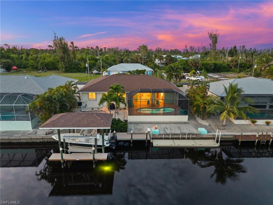 Direct Gulf Access Pool Home! Bring your boat and your sunscreen — this southern-exposure home is designed for living the Florida dream. Quick, deep, direct access takes you to Pine Island Sound’s world-class fishing grounds and the Gulf of Mexico, with Sanibel, Captiva, Cayo Costa, and Boca Grande just minutes away. Outside, enjoy a sparkling salt water heated pool, spacious screened lanai, a 30' floating kayak dock and an open-air deck overlooking the water — the perfect spot for a tiki hut, outdoor dining, or simply soaking in the views. The composite dock includes a boat lift, water, electric, and fish-cleaning station for the ultimate in boating convenience. Inside, the home feels light and bright thanks to vaulted ceilings and an open great room. The split-bedroom floor plan offers both comfort and privacy. The primary suite is a true retreat with two walk-in closets, dual sinks, a soaking tub, walk-in shower, and sliders opening directly to the lanai. The kitchen features granite countertops, stainless steel appliances, raised-panel cabinetry, a pantry, and eat-at bar. A laundry room with utility sink and cabinets adds extra convenience. Best of all, the interior of this home has remained high and dry with no flooding from recent hurricanes. Other features include: New Roof 2023 & New Water Heater 2023. This home blends comfort, style, and function with an unbeatable location for enjoying the best of Southwest Florida’s waterfront lifestyle.