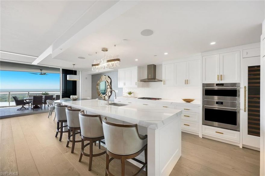Experience luxury coastal living at Kalea Bay in Naples, Florida, in this beautifully upgraded and fully furnished residence with sparkling Gulf views and refined designer finishes throughout. Located in one of Naples’ most sought-after waterfront communities, this spacious Kalea Bay condominium offers an open-concept layout filled with natural light, dramatic ceiling details, custom millwork, and thoughtfully designed living spaces ideal for full-time or seasonal living. Expansive glass doors create a seamless indoor-outdoor connection, showcasing breathtaking sunsets and the coastal beauty that defines luxury living in Naples FL.

The kitchen and butler’s pantry have been significantly upgraded with quartz countertops featuring 3" mitered edges, upgraded backsplash, chef’s sink and faucet, and custom cabinetry enhancements. Integrated appliance paneling elevates the design, including panel-ready refrigeration, wine refrigerator, and refrigerator drawers, along with a built-in Wolf microwave with custom cabinetry. Throughout the residence, crown molding, additional LED lighting, upgraded clear glass shower enclosures, frameless mirrors, and refined countertop details create a cohesive and polished design.

The primary suite serves as a private retreat with upgraded lighting, custom makeup vanity, enhanced quartz countertops with mitered edges, wall-to-wall mirrors, tiled shower bench, clear glass enclosure, and a striking tub accent wall. A custom primary closet completes the suite, offering exceptional storage and organization. Guest bedrooms and baths are equally well-appointed, ensuring comfort and privacy for family and guests.

This Kalea Bay Naples residence is ideally positioned directly across from The Club at Kalea Bay, providing immediate access to world-class, resort-style amenities. Residents enjoy multiple resort pools, poolside dining and lounges, fine and casual on-site restaurants, a state-of-the-art fitness and wellness center, pickleball, bocce, guest cottages, dog park, beauty salon, business center, and a vibrant calendar of social events. Guard-gated with 24-hour security, Kalea Bay offers one of the most desirable luxury condominium lifestyles in Naples Florida.
