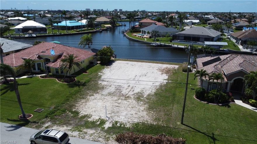 BEAUTIFUL GULF ACCESS LOT with a BRAND-NEW SEAWALL and amazing wide intersection canal view. This lot is located in an upscale neighborhood. CITY WATER/SEWER ARE IN AND ASSESSMENTS ARE PAID! It is perfect for cruising canals, or you can head to the Gulf of Mexico and experience some of the most amazing beaches and the Islands of Cayo Costa, Cabbage Key, Sanibel, Captiva, and Boca Grande. Build your dream home with NO 1.5-year waiting time because the seawall is already in and the shoreline is cleared. Secure this lot before it’s gone! Thank you for your interest in my listing.