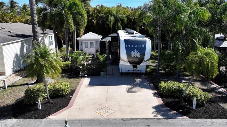 Lot C118 is an oversized and thoughtfully improved RV lot located within the highly desirable Cypress Woods RV Resort. Measuring approximately 53x90 (4,783 square feet), this property offers a functional layout, quality upgrades, and exceptional privacy.
The painted concrete slab provides a clean, polished, and low-maintenance foundation for your coach and outdoor living space. A 12x16 hard-top gazebo with electric enhances the outdoor area, creating a comfortable setting for dining, entertaining, or relaxing in the shade.
The fully finished accessory building adds significant value and flexibility, featuring a glass shower enclosure, bidet toilet, Murphy bed for additional sleeping space, mini-split air conditioning system, and washer/dryer hookups. Modern improvements and efficient design make the space both comfortable and practical.
Surrounded by walls and mature canopies of tropical palms, the lot offers privacy and a serene, resort-style atmosphere. This well-maintained property is ideal for seasonal enjoyment, full-time RV living, or investment within one of Fort Myers’ premier gated RV communities.