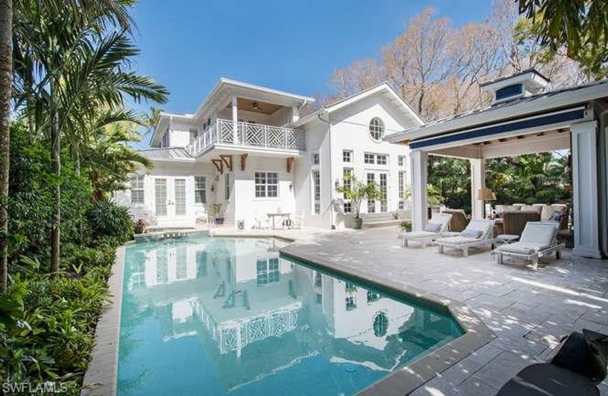 Spectacular four bedroom, plus den two story home with a thoughtful and efficient use of space. Ideally situated, nestled just blocks from the celebrated beaches of Naples, Florida and within a short distance of the internationally recognized cultural district of "Fifth Avenue South."  The unique downtown location features an expansive garden area featuring a pool, spa and large outdoor cabana with a gas fire place. The large first floor master suite has a generous walk-in closet and a luxurious master bathroom with bathtub, dual sinks and spacious shower. The open floor plan and large outdoor areas are perfect for entertaining. The well-planned kitchen includes a large island that leads out to a multi-functional great room with soaring ceilings and walnut flooring. This highly sought after and rarely available single family home with bright and beautiful views from every room will certainly impress. This offering represents a rare opportunity to enjoy the best Old Naples has to offer.