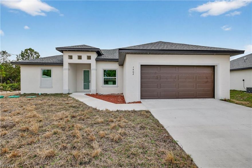 This move-in-ready property in Lehigh Acres, Florida, boasts several attractive features:
Impact Windows and Doors: The home is equipped with impact windows and doors throughout, a significant 
advantage in Florida's climate.
Modern Appliances: It includes stainless steel appliances and a washer and dryer, suggesting a modern and 
convenient living space.
Spacious Lot: The property sits on a 0.50-acre lot, providing ample space for outdoor living, including a potential 
patio area.