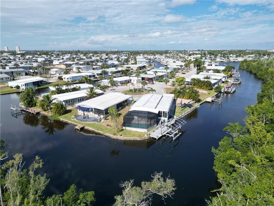 If the well-known term Location, Location, Location ever meant anything, this is definitely it.  Located at the end of the coveted Bryan Court Cul-de-Sac, this home has it all.  Two bedrooms, two bathrooms, huge great room encompassing the dining area, living area and kitchen.   Walk through the sliding glass doors to the Florida room with views to die for.  Or take a few more steps to private massage room to work out those kinks.  You can park two cars in the garage, one in front of the other.  The innermost portion of the garage has been air conditioned and is plumbed making this area ready to convert to a third bedroom if desired.  Top it all off with a private pool and you can see how this home would appeal to the distinguished buyer. The home has been retrofitted with a total of seven highly efficient minisplit air conditioners controlled by two separate compressor units.  The pool and air conditioners have been upgraded with smart technology thus can be control via your smart phone.  This home's location at the tip of the Bryan Court peninsula means you are surrounded by water views and nature that are truly unmatched.  This home has many other features that you can check out when you make an appointment to see it.  This home is simply amazing.  
Bayside Estates is the best kept secret of Fort Myers Beach. This incredibly active and friendly 55+ community is the crown jewel on the gulf coast. Bayside estates is only 2.5 miles to the beach and is accessible by either car or boat--right from either your driveway or private boat dock. A very popular activity is to ride your electric bicycles to the beach for the day and visit the world-famous Jimmy Buffett’s Margaritaville. Just don't step on a pop-top!! Nearly all the major retail vendors are within a very short driving distance for ultimate convenience. For those who don’t know a lot about Bayside Estates, it is a very fun place to call home---some would even say it’s a mature person’s playground. Whether you want to play pickleball, tennis or bocce ball, hang out at the community pool, skinny dip in your private pool or simply cruise the hood in your swanky golf cart, there is always something going on around here. People are friendly and you will be warmly welcomed.