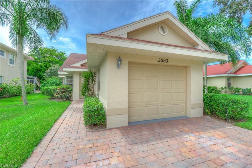Great find...Single Family Home with Garage under $300,000 with LOW FEES!!! 2019 brought you NEW A/C, NEW ROOF, STAINLESS KITCHEN APPLIANCES, PAINTED in a light pearl grey, and NEW CARPET. Make this neutral palate your own.  From the moment you drive into this community, you get that tropical feeling of a lushly landscaped Paradise.  Bright, cheery and open is what most buyers are looking for in their clean as a whistle Florida home.  Moment away from all you may wish for in dining, shopping, entertainment and the white sugary sand beaches Naples is known for. Recreational facilities include 2 community pools of which one has a bar and grill and hot tub, clubhouse, sauna, bocce, a very active tennis center with staff tennis pro and pro shop.  Great schools for your children.  An opportunity not to be missed, to own a single family home in move in condition under $300,000 with low fee gated community in Central Naples. Your very own private generously sized lanai awaits you, your family and guests. Long double wide driveway. BEST VALUE IN THE COMMUNITY! Moments to dining, entertainment & sugary sand beaches.  Just under 30 minutes to Fort Myers International Airport.  See it today!