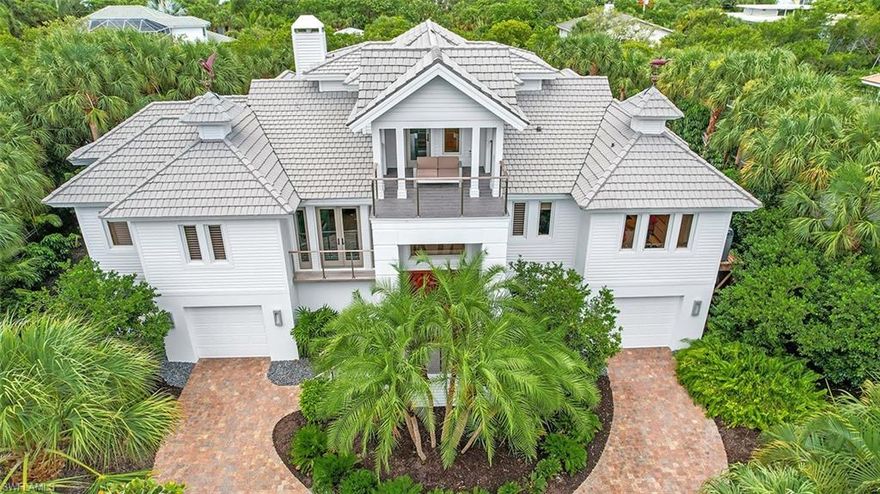 Located on an oversized lot w/direct access canal & dock on prestigious Lighthouse Way, this home was renovated in 2018/2019. Coastal contemporary home w/interior design by Dwayne Bergman Interiors. Concrete construction (first two levels). New kitchen, bathrooms, hand-painted white oak flooring. Primary suite is breathtaking, huge primary bath w/high-end finishes. Custom closet w/built-ins - biggest closet you've ever seen. Living room w/fireplace & wet bar. Contemporary kitchen offers Cambria countertops, center island, custom cabinetry, high-end appliances & large hidden pantry - all open to living room. Custom his & hers home office w/balcony.
Large, heated saltwater pool w/spa & brick decking and 2-story screened enclosure (new as of 2019). Home is wind mitigated & features all the latest technology. Spacious screened lanai, two guest bedrooms, sundeck, glass stairway. Lots of lower-level storage. Like new & priced to sell. Completely furnished. One of a kind opportunity!