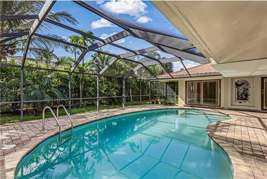 One or more photo(s) has been virtually staged, AI generated or rendered.  STUNNING TOTAL & COMPLETE REMODELED ($500,000+/-) EUROPEAN DESIGN 3 BEDROOM, 2 BATH,  2 CAR GARAGE, "SALT SYSTEM" HEATED POOL HIGH END FINISHES! Great curb appeal, with circular" paver" driveway entry. Hugh open floor-plan with IMPORTED POLISHED ITALIAN 32" X 32" PORCELAIN TILE THROUGHOUT THE ENTIRE HOME. Home's ceiling are all finished with crown molding and wood milled "baseboards" for that "chic" European design. ALL WINDOWS-DOORS-SLIDERS ARE DOUBLE-PANNED HIGH INTENSITY ($100,000+) "IMPACT" STORM RESISTANT W/BUILTIN BLINDS IN ALL. "CHEFS" kitchen with custom finished "CHERRY-WOOD" CABINETS (soft-close drawers & doors), HIGH END SAMSUNG STAINLESS STEEL APPLIANCES, LEVEL 5 GRANITE TOPS & EAT-AT-BAR for family kitchen gatherings.  The front doors are complemented by elegant "double" doors, home also features ALL NEW ROOF (Stone Coated Metal Roof), ALL NEW ELECTRICAL SYSTEM ( All Copper Wiring) AND NEW PLUMBING. Additionally the HVAC replaced in 2021, and water heater in 2019. The freshly painted garage is immaculate, and property has mature, beautiful landscaping to enhance the curb appeal.   A rare opportunity to own a fully REMODELED, EUROPEAN DESIGNED Florida pool home with HIGHEST AVAILABLE UPGRADES throughout. HOME COMES WITH A ONE YEAR "HOME WARRANTY" FOR TOTAL BUYER COMFORT!