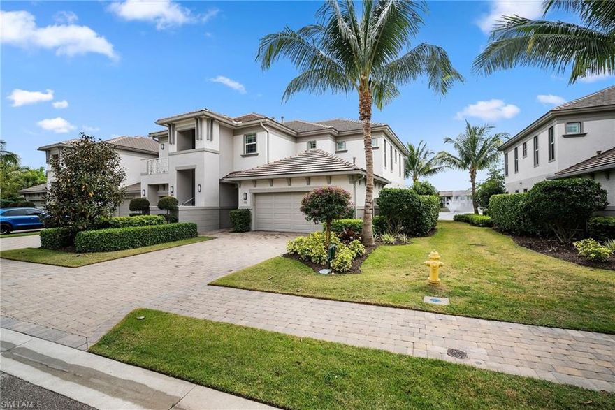 Stunning FURNISHED Signature Club rarely available first floor coach home with panoramic views of a 5 acre lake and 2 fountain water feature! Meticulously maintained and professionally decorated with a bright neutral pallet and move in ready! Beautiful white kitchen cabinets with upgraded SS natural gas appliances to include a warming drawer, subway tile backsplash, one level quartz countertops, custom window treatments, plantation shutters, custom closets, upgraded tile floors throughout living area including den with carpet in primary and guest bedroom, convenient wet bar in dining room with glass front cabinets and welcoming  entry foyer! Enjoy the luxury of STORM SMART electric hurricane screens on lanai! The Signature club offers a private entrance into The Players Club! Enjoy all the amenities with immediate membership to The Players Club and Spa, 2 resort pools, lap pool, tiki bar, fitness facility, full service spa, fine dining, movie theatre, billiards room, pickle ball, tennis and bocce! The Classics private golf is optional at Lely Resort but there are 2 public golf courses to enjoy! This IS where you want to live!!