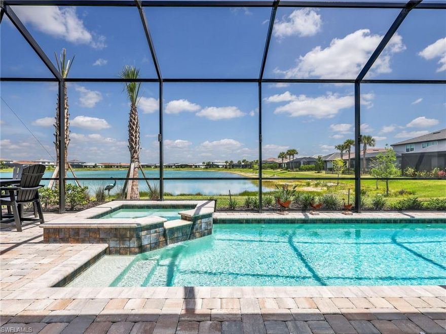 This impeccably upgraded residence delivers a level of finish and functionality that goes far beyond standard newer construction set on a tranquil lakefront homesite within Verdana Village. Offering 3 bedrooms plus a den and 4 baths (3 full and 1 half bath), the layout is designed for comfort, privacy, and effortless entertaining. Each bedroom is its own private retreat, complete with an ensuite bath and walk-in closet, while a generously sized den provides a true flex space—ideal for a home office, media room, or additional guest accommodations. Inside, the home is elevated by refined details including crown molding, custom detailed woodwork, plantation shutters, and motorized window treatments that blend style with everyday ease. The upgrades continue behind the scenes and throughout the property, with a whole-house Generac generator, whole-house water softener system, and an AC mini-split in the garage enhancing both efficiency and livability. The oversized 3-car garage has been extended by four feet, offering exceptional storage and versatility. Outdoor living is where this home truly shines. A sprawling screened lanai frames peaceful lake views and is outfitted with motorized storm screens for protection and peace of mind. The custom summer kitchen is a standout feature boasting a grill, cooktop, flattop, sink, drink cooler, ice maker, and a two-tap kegerator—creating a fully equipped outdoor entertaining space that rivals anything indoors.
Beyond the home, residents of Verdana Village enjoy a vibrant, resort-style lifestyle with amenities that include a state-of-the-art fitness center, resort and lap pools, indoor and outdoor sports courts, dining venues, and a full social calendar. Ideally located, you’re just minutes from Southwest Florida International Airport and the Hertz Arena—home to concerts, events, and entertainment—along with shopping, dining, and everyday conveniences.
Polished, thoughtfully upgraded, and perfectly positioned—this is lakefront living in Verdana Village at its finest.  THERE ARE TWO VIRTUAL TOUR LINKS YOU CAN CLICK ON FOR MORE INFORMATION.