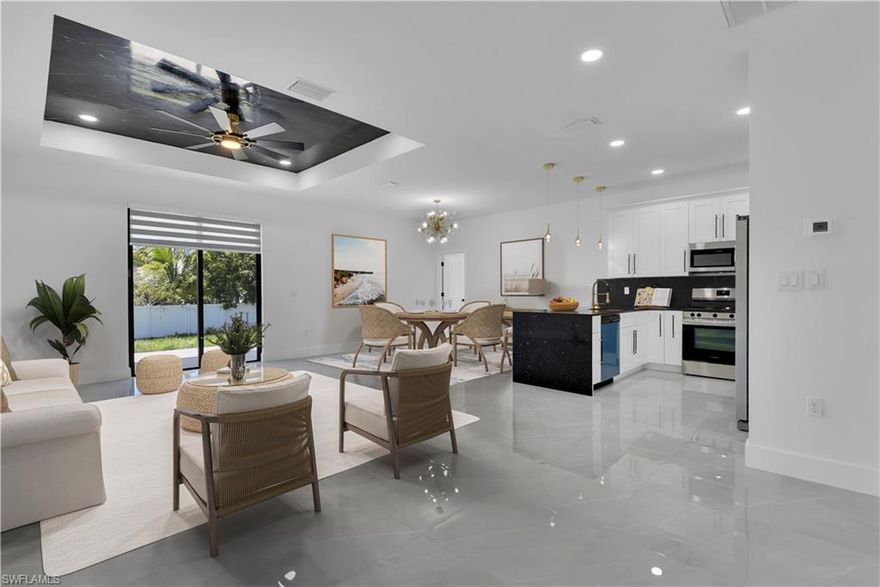 Exquisite Living Experience and Helping with Buyer's Closing Costs! Come to enjoy our featured listing of the month. This trophy single-family residence offers a very spacious layout with modern and breathtaking upgrades. It is a 3 bedroom 2 bathroom and 2 car garage and large extended back porch, one story home centrally located in one of the best areas in Lehigh Acres. Among many more novel attributes, this home offers a spacious gourmet kitchen with LED Raindrop Pendant Lighting and a dining room with a modern 8 Lighting golden Chandelier. Two shower bathrooms exhibiting black and brushed golden vanity faucets, LED bathroom antifog dimmable memory lighted mirrors, shower niche golden framed, and hand shower wall mounted. Its soaringly designed Resina Epoxy and recessed LED lighting living room ceiling is a masterpiece, marvelous black galaxy polished granite kitchen and bathroom countertops, and 5 inches luxury baseboards. Flooring 24 x 24 porcelain tile all around the house, additional laundry/folding room with extra cabinetry, and black/golden handles. The kitchen features a faucet w/pull-down sprayer, a steel dual sink, stainless steel appliances, and much more... There are 4 more locations available in SW LEHIGH ACRES 33976 with the same layout and ready to move!!