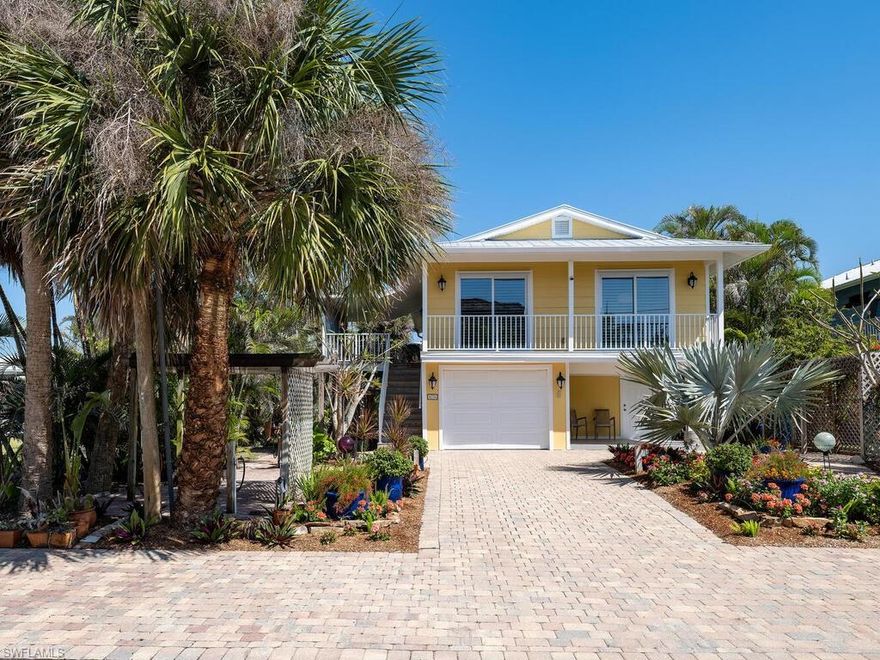 Charming furnished Key West-style Gulf-access cottage perfect for a getaway this winter season.  Rarely Offered Gulf access just minutes to New Pass and the Gulf. High & dry upper-level great room, master Plus den and a 19-ft covered deck. Ground-level garage, storage & workshop. Brick pavers everywhere: on driveway, walkways, & backyard featuring a 33x10 ft pergola. Botanical plantings include mature orchids naturalized in trees. No grass to cut. Manual storm shutters, fish clean station, rain barrel. Newly painted interior and exterior. Estero Bay Shores is an intimate waterfront neighborhood tucked between Pelican Landing & The Colony west of Rt 41 on the edge of Estero Bay, just 5 min to Coconut Point Mall, 23 min to the RSW airport. Built 1986, updated in 2003, the seawall was new 2005. There are no rental restrictions or homeowner association fees.