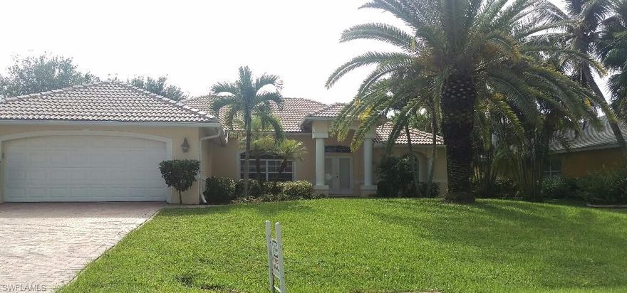 Prestigious Rose Garden location!!! Minutes to Tarpon Point Marina! Located across from high end waterfront homes, this meticulously maintained 3 bedroom, 2 bath pool home shows like a model. This home is loaded with upgrades!  Tile in main living area, master bedroom has two sets of sliding doors to the lanai and pool area. The great room has 18 feet of sliders that open up to a spacious lanai great for entertaining, along with a heated pool, spa and mature landscaping to highlight this beautiful home. ONE YEAR HOME WARRANTY INCLUDED!!