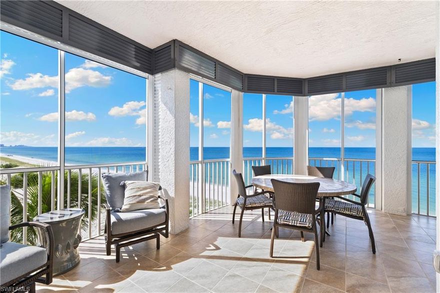 RENOVATED & COASTAL CONTEMPORARY DIRECT BEACHFRONT END-UNIT in North Naples’ coveted Barefoot Beach Club! Perfectly positioned on the desirable south end of the building, this residence enjoys unobstructed WEST and SOUTH views that stretch all the way to Vanderbilt Beach. Enjoy pristine white sands and sparkling turquoise water of the Gulf as your everyday backdrop. This 3 bed/3 bath coastal retreat offers an open floor plan with over 2,000 sq ft under air, hurricane impact sliders, electric storm shutters, and elegant wood-look tile flooring. Rare end-unit windows bathe the interior in extraordinary natural light. Step outside to your expansive wraparound screened lanai with panoramic Gulf views and breathtaking sunsets. The chef’s kitchen boasts a wood-paneled ceiling, custom cabinetry with glass-front details, granite countertops, and an oversized island with range hood. The primary suite is a private sanctuary with Gulf views, lanai access, and a spa-like bath with dual vanities and a large glass-enclosed shower with rainfall showerhead. Nearby to the BRAND-NEW CLUBHOUSE with state-of-the-art fitness center & resort-style pool. Barefoot Beach residents enjoy 3 miles of beach, 2 pools/spas, manned/gated entry & on-site mgmt. OPTIONAL “Club at Barefoot” offers tennis, 2 restaurants & beachside food/bev/chair service. Excellent Collier County location minutes to Mercato, Waterside & easy access to RSW Airport.