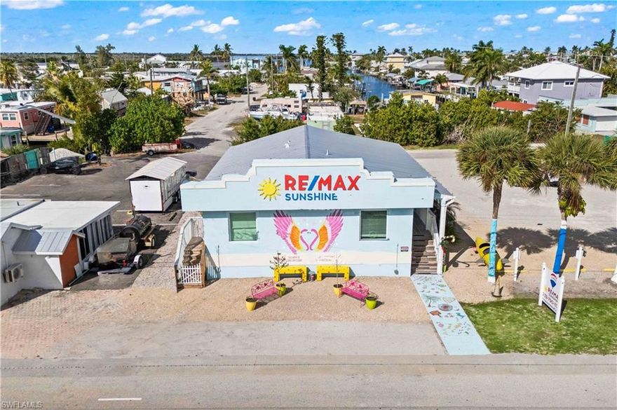 Position your business at Matlacha’s most visible corner location! This fully remodeled commercial property at 4574 Pine Island Rd NW is currently operated as a real estate office and offers exceptional exposure plus two access points for smooth ingress/egress—ideal for trucks, service vehicles, and client traffic. Recent upgrades include a NEW roof, new flooring, and impact-rated hurricane doors and windows for peace of mind. The interior is light, bright, and inviting, creating a professional atmosphere for clients and staff. An ADA-accessible ramp enhances usability and compliance. Fantastic opportunity for a real estate office, professional services, medical office, retail showroom, or boutique business looking for maximum visibility at the gateway to Matlacha/Pine Island.  Extensive parking and NEVER flooded!  Traffic Count (16,100 AADT (average annual daily trips/vehicles per day) along the Pine Island Road corridor near Matlacha.