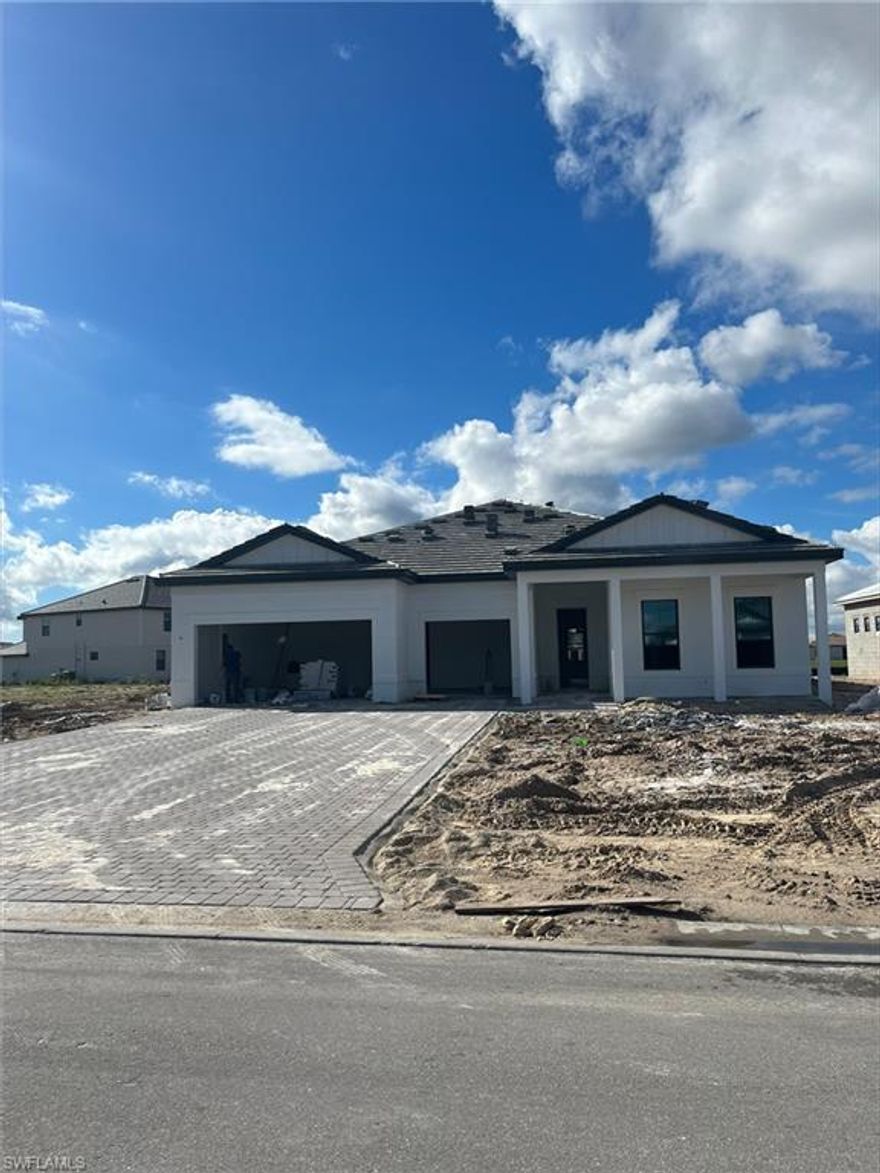 Move to Verdana Village! This Renown home is being built and will be ready to move in by April 2024. The home features a lake view on an oversized lot, zero corner slider out to your lanai, 3 car garage with 4' extension and epoxy flooring, full laundry upgrade, walk-in kitchen pantry plus a wine cooler, quartz countertops & so much more! All three bathrooms also have walk-in closets. Tile flooring in the main area with carpet in the bedrooms. Last but not least, whine down for the night on your lanai (rear west exposure) as you watch the beautiful Florida sunset right on the lake!