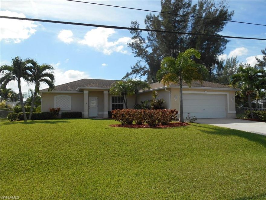 Looks like new, feels like new and now you can buy like new as this home has a 1 year Old Republic Home warranty for a worry free purchase.  You can own unfurnished or if you wish as a complete turn key home with all the furniture at no extra charge.  All city utilities are in and paid plus it located on a fresh water canal.  This home is in excellent condition with cathedral ceilings, tile & carpet, raised panel cabinets and stainless appliances.  It is tastefully decorated and does not require flood insurance.  It has a fenced yard, lush landscaping and an attractive front elevation. Come and see this great find today!  You will be glad you did.