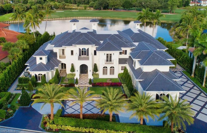 Virtually every aspect of this magnificent golf estate that resides on a picturesque wide lake with golf and preserve views has been meticulously updated. From the entire exterior, including a new roof, to a brand new gourmet kitchen, this home has been tastefully remodeled throughout its over 9,500 square foot, 5 bedroom, 7 full and two half bath livable floor plan. Top of the line features include a centrally located theater room with new equipment, a Control4 home automation system, and a walk-in climate-controlled wine room. Nothing has been overlooked in this incredibly located home, including a spacious covered outdoor living area complete with a gas fireplace, new pool and tile, and a full summer kitchen perfect for entertaining family and friends, all enclosed with automated screens at the touch of a button. This spectacular property also includes a large owner’s suite with dual baths and closets, a VIP suite with morning bar, a bonus room above the garage, and a wood-paneled study with long-range lake and golf course views. A world of luxury awaits you in the exclusive Grey Oaks Country Club community, minutes from all that Naples has to offer.