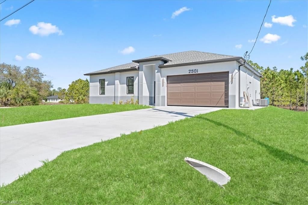 Photo of 2507 E 15th ST, LEHIGH ACRES, FL 33972 (MLS # 226013825)