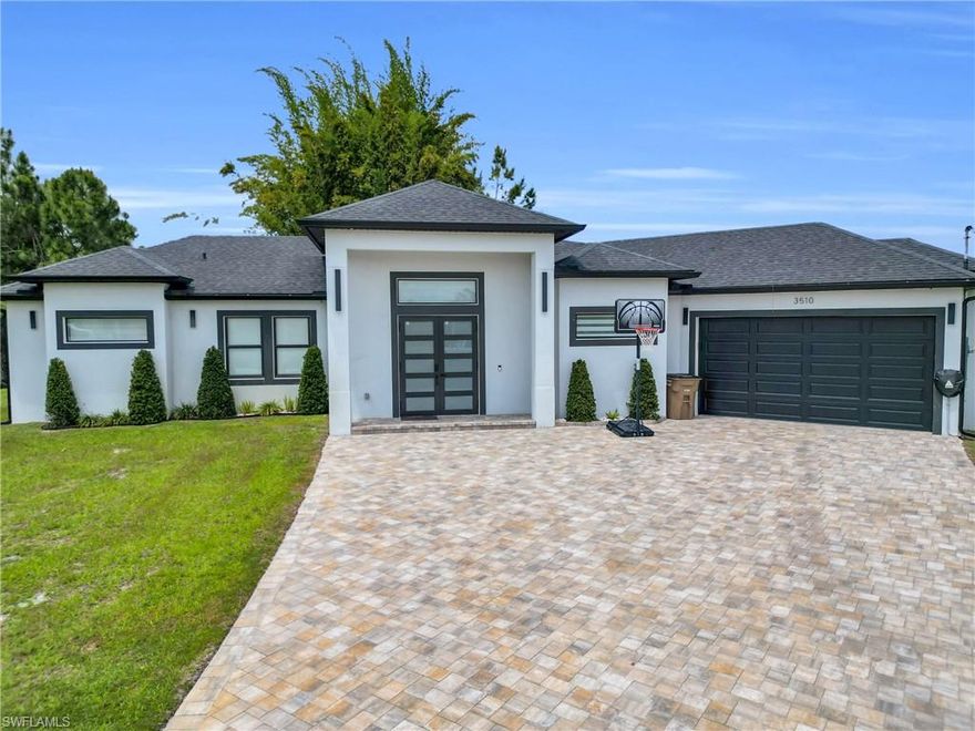 Welcome to this beautifully designed single-family home offering 3 bedrooms, 3 bathrooms, and 1,937 sq ft of living space, perfectly situated on a spacious 0.37-acre cul-de-sac lot. This open-concept home features a modern layout ideal for both everyday living and entertaining.

The gourmet kitchen is the heart of the home, showcasing a large quartz island, shaker cabinets, and sleek finishes that continue throughout the bathrooms. The primary suite is a true retreat with a luxurious bathroom featuring double sinks, a separate soaking tub, and a walk-in shower.

Additional highlights include impact windows, recessed lighting, and epoxy flooring in the garage for a clean, polished look. Step outside to enjoy the tiled lanai and fully equipped outdoor kitchen—perfect for Florida living and hosting guests year-round.

This home combines style, comfort, and functionality in a desirable cul-de-sac location with plenty of space to enjoy both indoors and out.