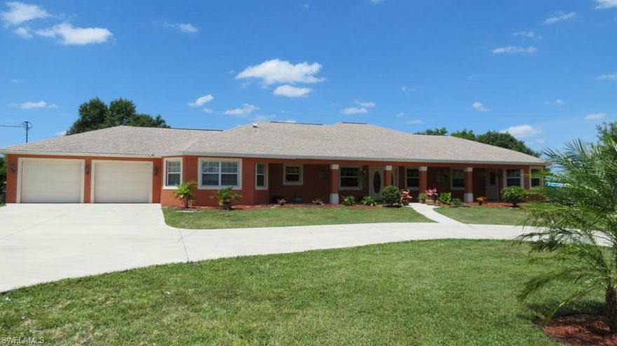 Gorgeous home built in 2006, situated on 3 beautiful acres, approx 40 oak trees, 396 feet of waterfront on canal that runs length of property, a pond that is fully stocked with big bass. 4 bedrooms, including large mother-in-law suite that is separate from other bedrooms with private entrance, private bathroom, and walk in closet. Plenty of space and a wide open lay out, this home could easily be 5 or 6 bedrooms.  18 terracotta porcelain tile throughout most of home, trayed ceilings in master & mother-in-law suite.  Master suite is huge with extra luxurious bath, double vanity, lg walk-in shower with 2 shower heads, separate Jacuzzi  tub & large walk in closet, master also  has an adjoining  room with hard wood flooring which could be used as a nursery, work out room or office with it's own private entrance. Large chef's style kitchen that features high ceilings, stainless appliances, island, and tons of cabinets and counter space. Sprinkler system, alarm system, dock and much more.