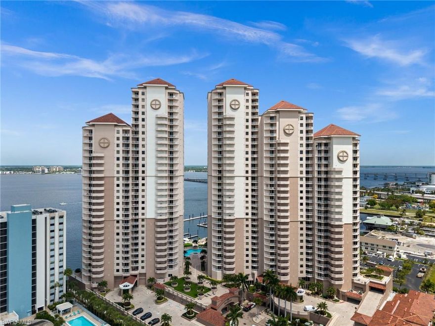 Luxury downtown riverfront living awaits at High Point Place! This immaculate 8th-floor condo features over 2,100 sq ft of living space, with three bedrooms, two and a half baths, two balconies, and a private elevator lobby. Tastefully updated, the residence impresses from the moment you step through the French doors of your entry, with sweeping river, marina, and city views that draw you in and welcome you into a space where the view is the focal point of the home. The kitchen, updated in 2024, offers Cambria quartz countertops, updated appliances (including an induction cooktop), undercabinet lighting, and upgraded 24x48" tile flooring. The living room features engineered hardwood flooring and a built-in electric fireplace, flowing into the dining area and out to a spacious, screened balcony where you can relax, unwind, and watch the boats go by. The primary suite offers direct balcony access and an elegant, remodeled en-suite bathroom (2024) that offers Cambria quartz countertops, dual sinks, soaker tub, glass-enclosed shower with a beautiful waterfall tile accent, tray ceiling, and new plumbing fixtures and features. The main guest bedroom has its own private open balcony with city view, while the second guest bedroom can serve as a bedroom, office, or den. Additional features include extra storage, newer water heater (2023), remodeled guest bathroom (2024), updated laundry room with newer washer (2021), dryer (2020) and leathered granite countertops, no-see-um screen on balcony, upgraded lighting fixtures, Cambria quartz countertops in guest bath and powder room, and newer interior paint (2024). High Point Place offers a full suite of amenities including a gathering room, pool and spa, fitness center, business center, on-site management, climate-controlled storage, and assigned garage parking. Located in the Historic River District, you are just moments from dining, shopping, local events, and the charm and history of the Edison and Ford Winter Estates. Schedule your private showing for Unit 807 and experience all that High Point Place offers.