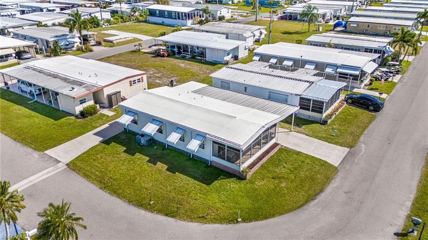 Experience modern comfort and Florida charm in this beautiful ground up renovated home in the gated 55+ community of Old Bridge Village. Bright and airy, this home features vaulted ceilings, new floors, drywall,  thermal windows, updated kitchen and bathrooms and a TPO roof.  Enjoy two lanais—one that is tiled and enclosed for privacy or entertaining, and another screened for outdoor relaxation. Set on a corner lot with two driveways, there’s plenty of room for vehicles or a boat, along with a large shed with washer and dryer for added convenience. Life at Old Bridge Village is about more than just a home—it’s a lifestyle. This resident-owned, 55+ waterfront community offers an abundance of activities and clubs, as well as amenities, including a brand new pool and hot tub, fitness center, and courts for tennis, pickleball, and bocce. The marina features boat and kayak launches, and Palm Point, a scenic gathering spot along the Caloosahatchee River, is perfect for sunrise strolls, golf cart rides (included), picnics, fishing and community events. With its ideal location just minutes from downtown Fort Myers and access to its lively cultural scene, restaurants, and shops, this home offers the best of both worlds: a tranquil riverside retreat and a connection to everything you love about Florida living! Come find your "Peace" of Paradise!