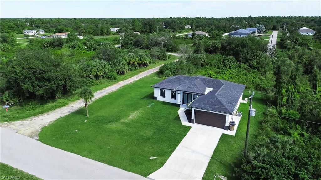 Photo of 519 Lone Star LN, LEHIGH ACRES, FL 33974 (MLS # 2025018244)