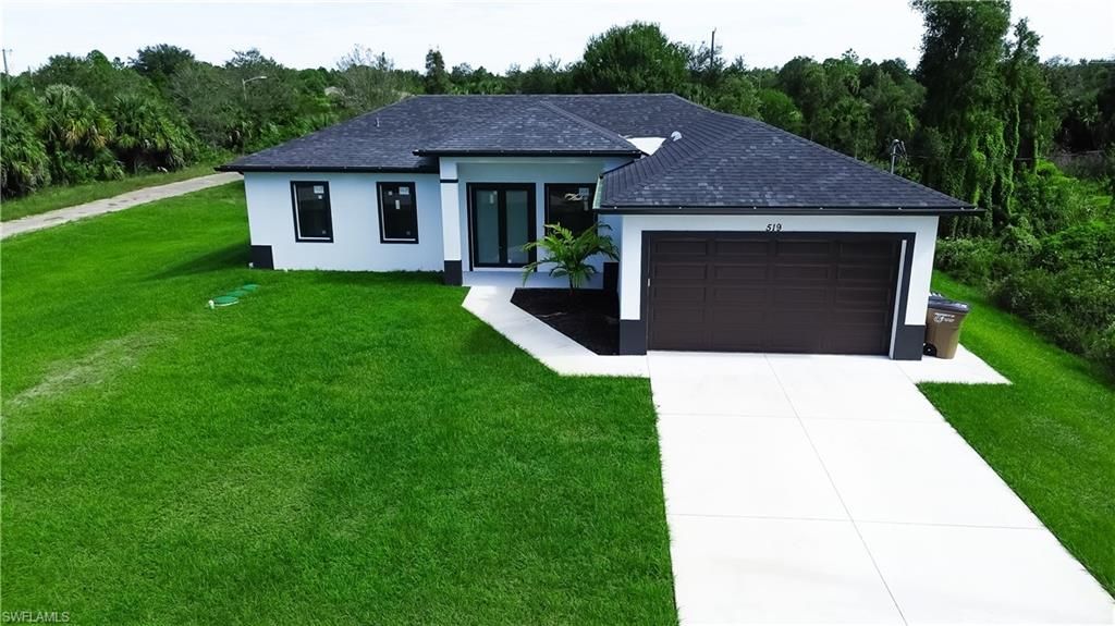 Photo of 519 Lone Star LN, LEHIGH ACRES, FL 33974 (MLS # 2025018244)