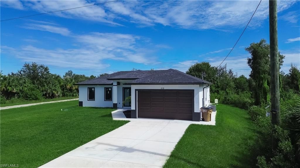Photo of 519 Lone Star LN, LEHIGH ACRES, FL 33974 (MLS # 2025018244)