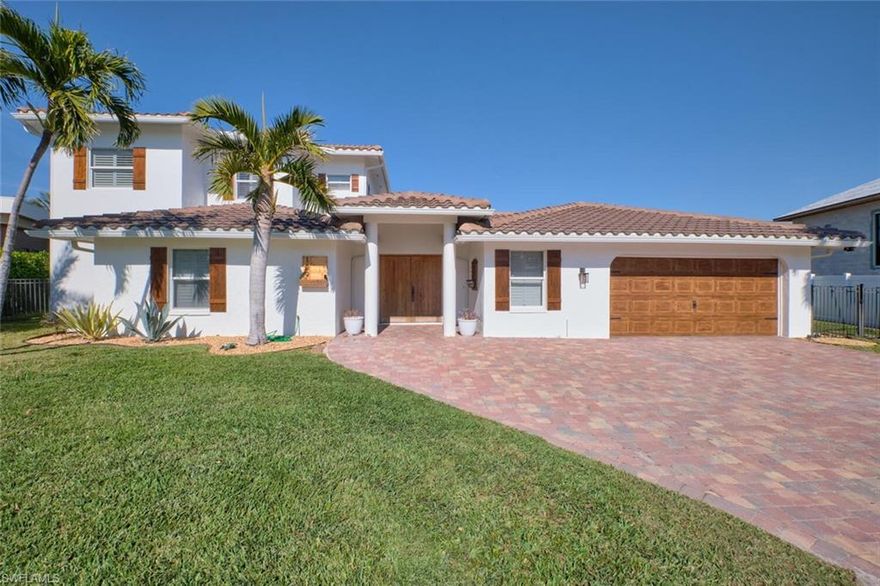 THIS HOME HAS IT ALL…Fall in love with the water view as you enter the French doors of this two story, 3+ bedroom 4 bath 2 car garage home - It can come furnished OR unfurnished. This open floor plan is perfect for family gatherings. A new kitchen that embraces the Italian spirit with a mix of modern functionality and old-world charm, featuring natural wood shelving, a spacious quartz island, and a stunning walk-in pantry. Work out of your private office with water views, built in shelving, French doors, and custom flooring. This home has a master bedroom on each floor both loaded with luxurious water views, fire places and private master bathrooms. new flooring throughout, plantation shutters, driveway pavers, and a salt water pool conversion. PLUS... a new clay tile ROOF and a FRENCH DRAIN in 2024. If you enjoy entertaining, patio and pool area are sure to be a crowd pleaser, complete with fruit trees and palms. This home also boasts a private dock and NEW COVERED BOAT LIFT (2022) on intersecting deep-water canals. Don't miss out on this piece of paradise! Long term lease is preferred but short leases are available at a 30 day minimum and are subject to tourist tax. Reach out to listing agent to discuss.