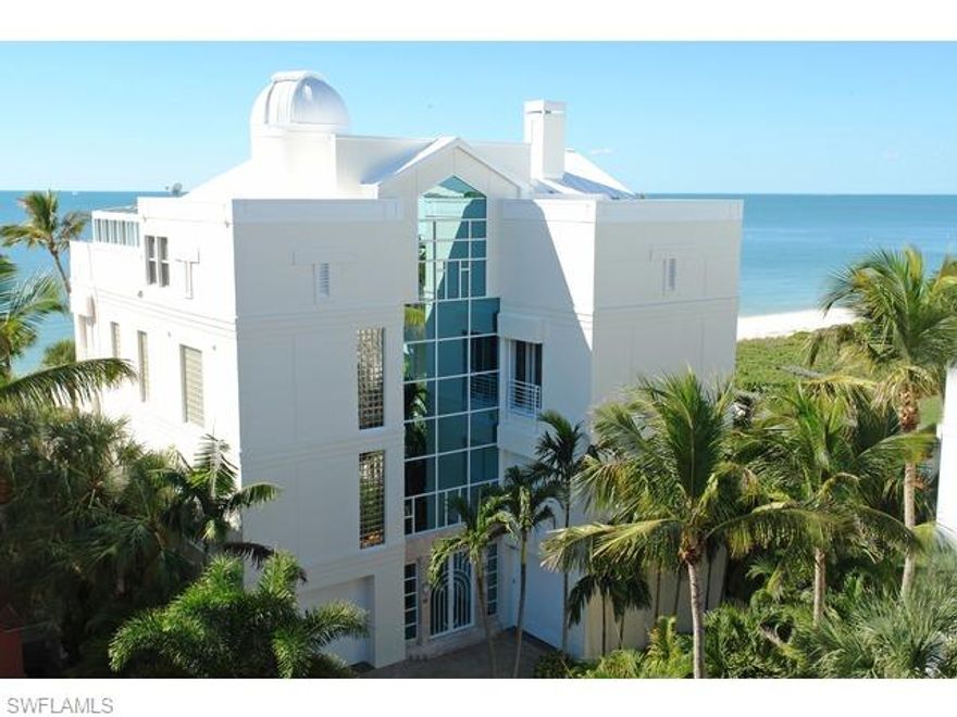Gulf front  4 story home offers features not found in any Naples area home regardless of price & 10' glass doors to 50' high glass foyer, glass atrium elev w/fiber optic lighting, lg gym area on the gulf w/juice bar & full ba w/lockers, a vintage ice cream parlor, a real 59 pink caddy convertible bar, diner, sports theater w/3-50" & 1-60" TVS,  pool table, slot machines, grt rm w/2 walls of glass, granite fp, open/covered decks, gulf dining rm w/builtins, dream kitchen,  eat-in, grilling deck, 4 or 5 bdr, 6 & 1/2 ba, ma bdr inc deck w/spa, office, star closet, ma ba w/his & her areas, movie theater,  4th flr on the gulf bonus rm & deck,  2nd kitchen off priv suite/play area, sunroom/greenhouse, 360 degree observatory w/computerized telesope, granite & wood floors, 14 flt screens & 2 proj syst,  onetouch lighting, impact sliders & elec shutters, 45KW Gen, 3 car gar(lift), park for 8, beach garden pool/spa, boat dock sep purchase.